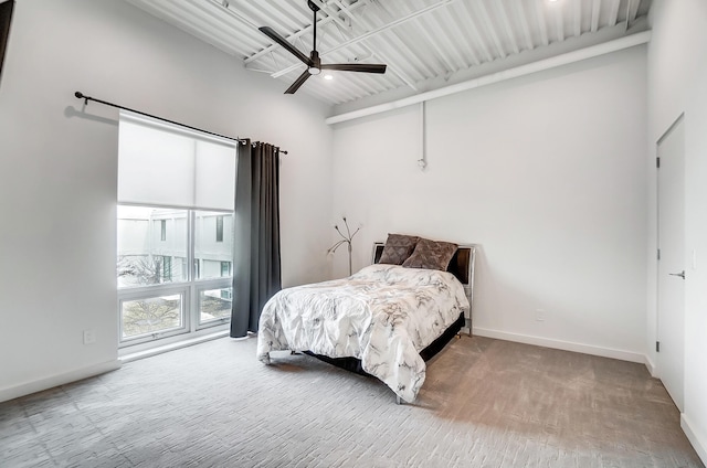 bedroom featuring a ceiling fan and baseboards