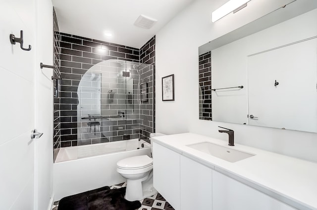 bathroom featuring toilet,  shower combination, and vanity