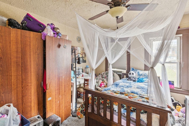 bedroom featuring ceiling fan and carpet flooring