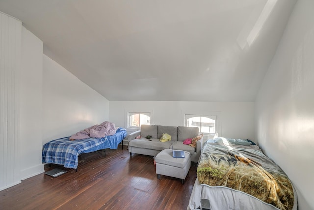 bedroom featuring lofted ceiling and dark hardwood / wood-style flooring