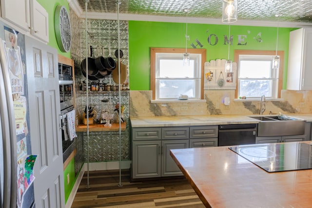 kitchen featuring gray cabinets, decorative light fixtures, white cabinetry, decorative backsplash, and black appliances