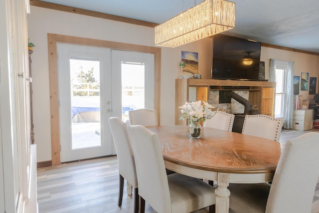 dining space featuring light hardwood / wood-style floors and french doors