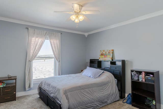 carpeted bedroom with crown molding and ceiling fan