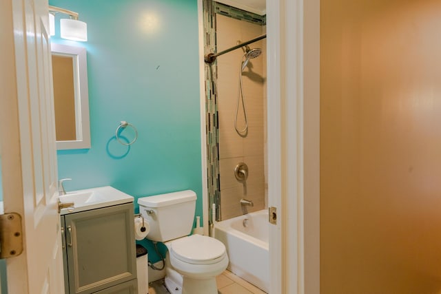 full bathroom featuring vanity, tiled shower / bath, and toilet