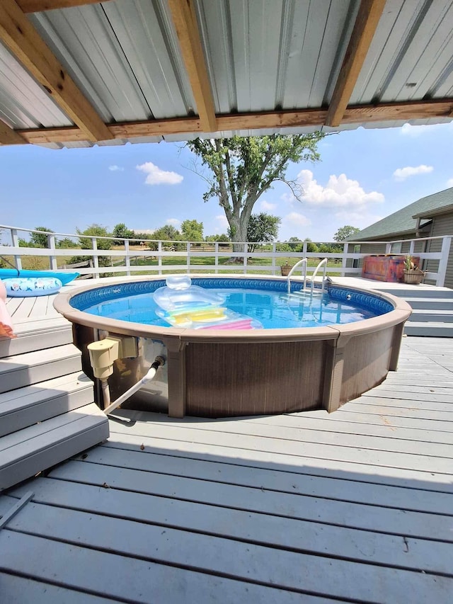 view of pool with a deck