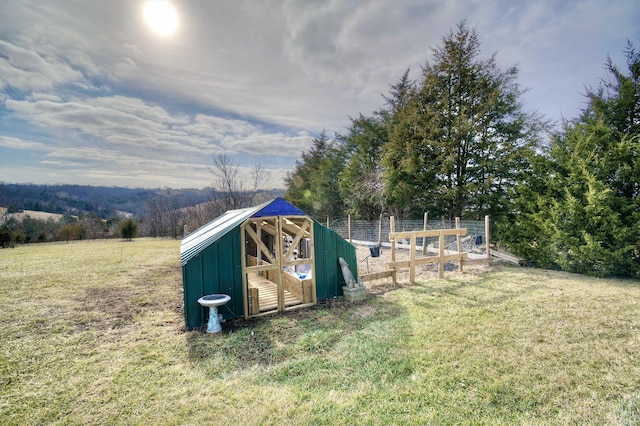 view of outdoor structure featuring a yard