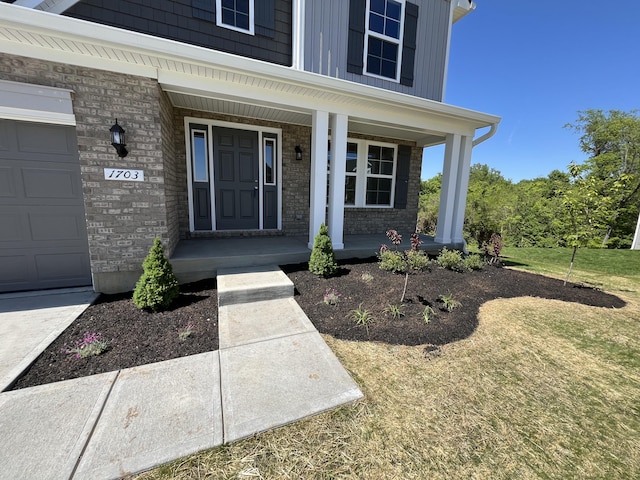 1703 Barons Cv, Hebron, KY 41048 - property entrance with covered porch and brick siding