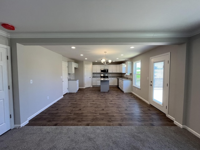 1703 Barons Cv, Hebron, KY 41048 - kitchen featuring stainless steel microwave, crown molding, white cabinetry, a sink, and baseboards
