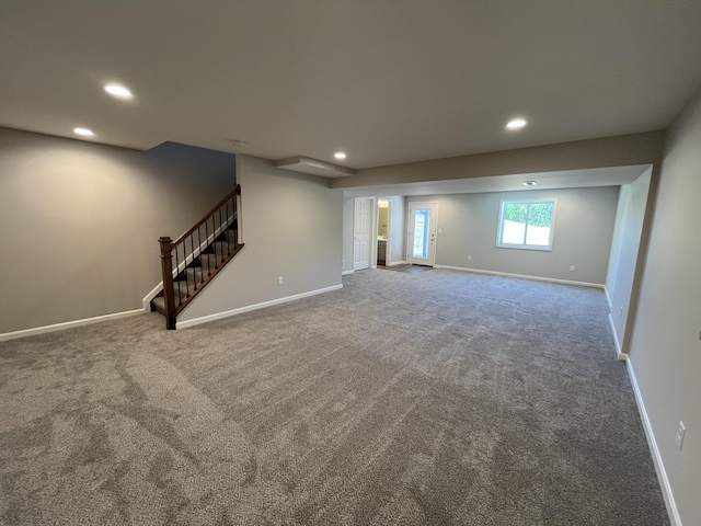 1703 Barons Cv, Hebron, KY 41048 - unfurnished living room with recessed lighting, baseboards, stairs, and carpet floors