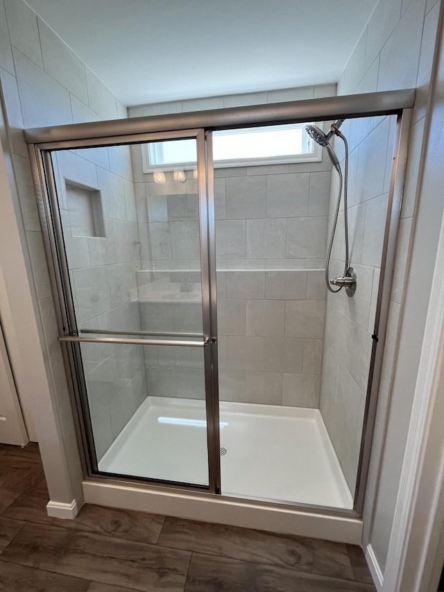 1703 Barons Cv, Hebron, KY 41048 - bathroom with a stall shower, baseboards, and wood finished floors