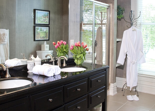 bathroom featuring tile patterned floors, toilet, and vanity