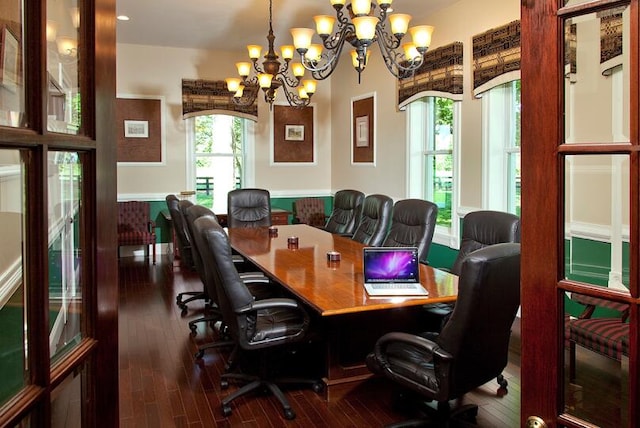 home office featuring a notable chandelier and dark hardwood / wood-style floors