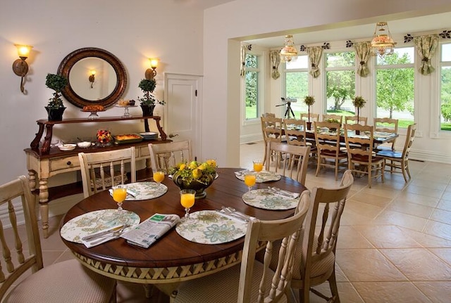 dining area featuring light tile patterned floors