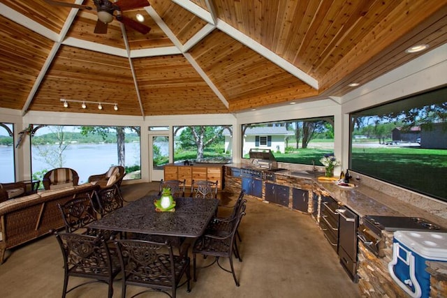 view of patio with a gazebo, ceiling fan, and an outdoor kitchen