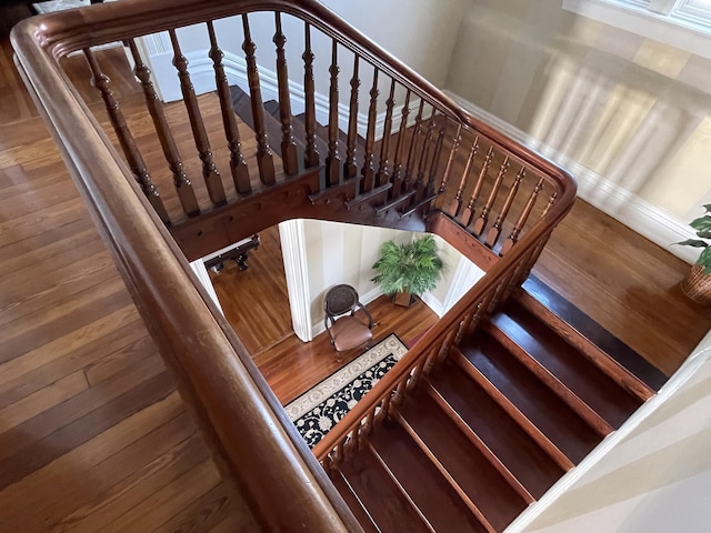 staircase featuring hardwood / wood-style floors