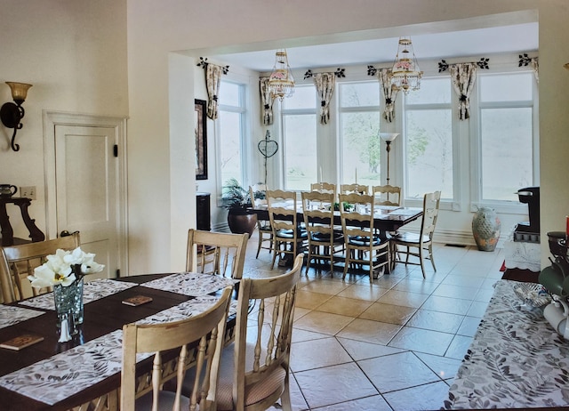 dining area featuring light tile patterned floors