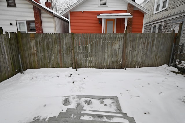 view of yard layered in snow