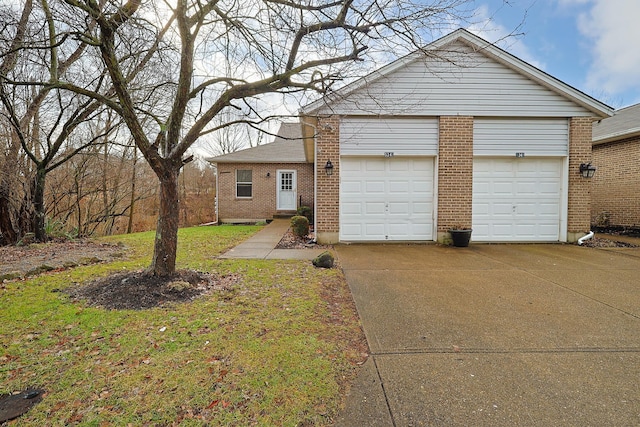 view of front facade featuring a garage and a front lawn