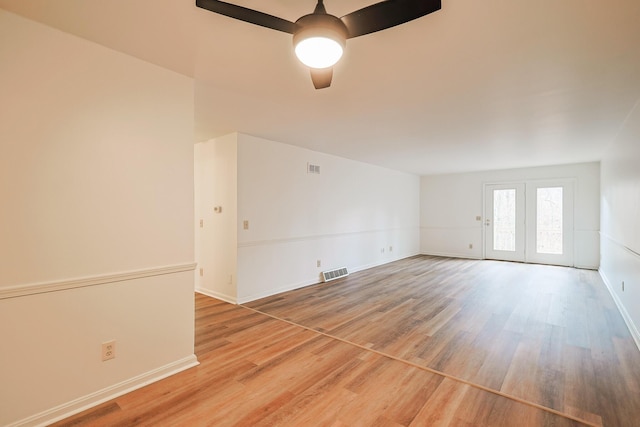 unfurnished room featuring hardwood / wood-style flooring and ceiling fan