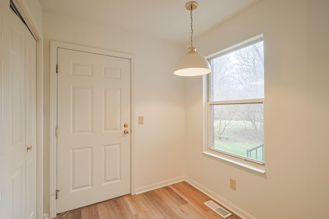 unfurnished room featuring light wood-type flooring