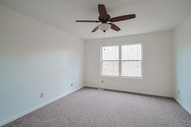 carpeted empty room with ceiling fan