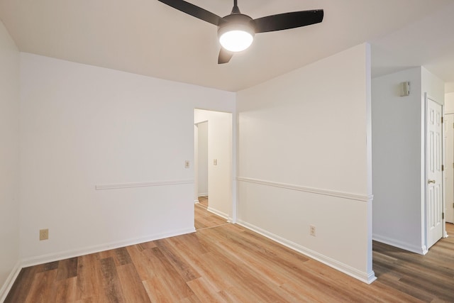 spare room with wood-type flooring and ceiling fan