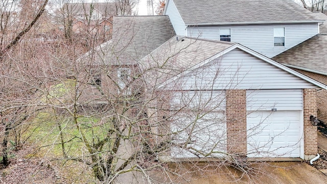 view of side of property with a garage