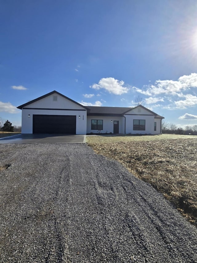 ranch-style house featuring a garage