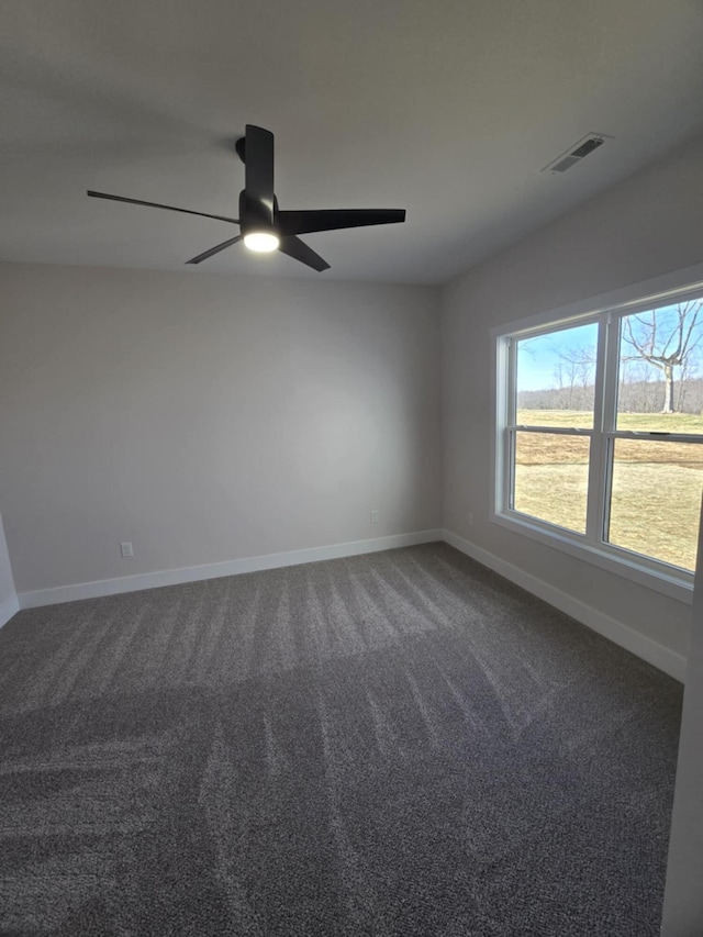 spare room with carpet and ceiling fan