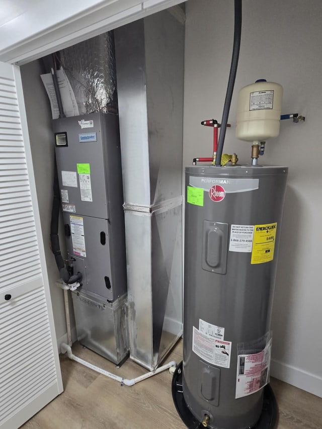 utility room with electric water heater