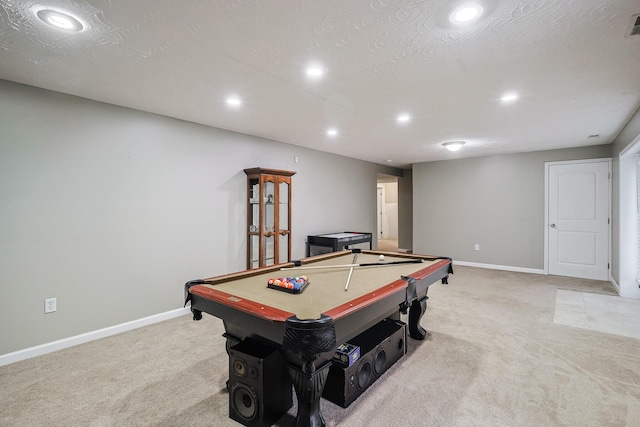 game room featuring billiards, light colored carpet, and a textured ceiling