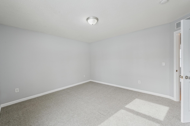 empty room featuring carpet floors