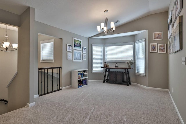 miscellaneous room with an inviting chandelier, lofted ceiling, and carpet floors