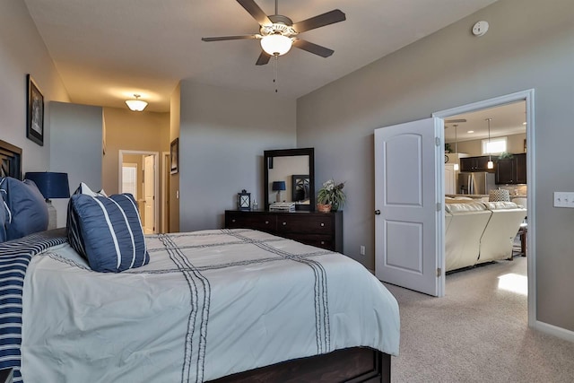 bedroom featuring light carpet, ceiling fan, and stainless steel fridge with ice dispenser