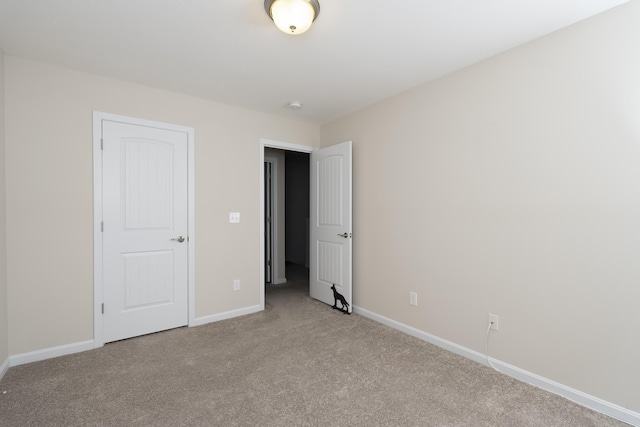 unfurnished bedroom featuring light colored carpet