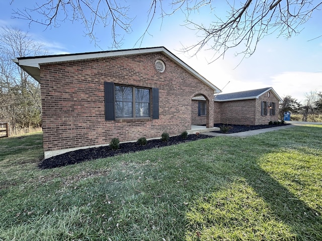 view of home's exterior featuring a lawn