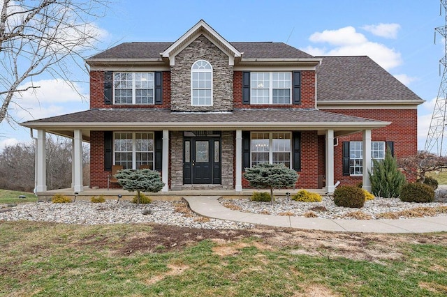 view of front of home featuring a porch and a front yard