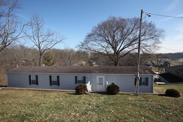 back of house with a yard