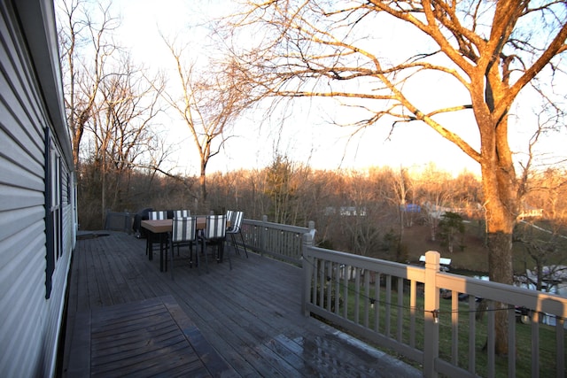 wooden deck featuring outdoor dining area