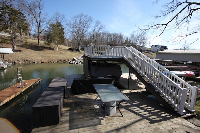 dock area with a water view and stairway