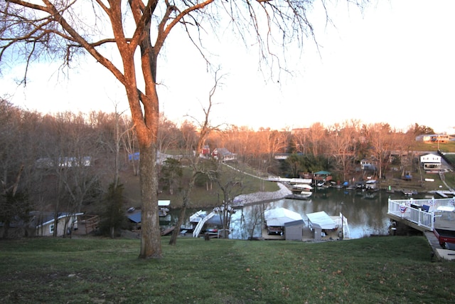 exterior space with a water view and a yard