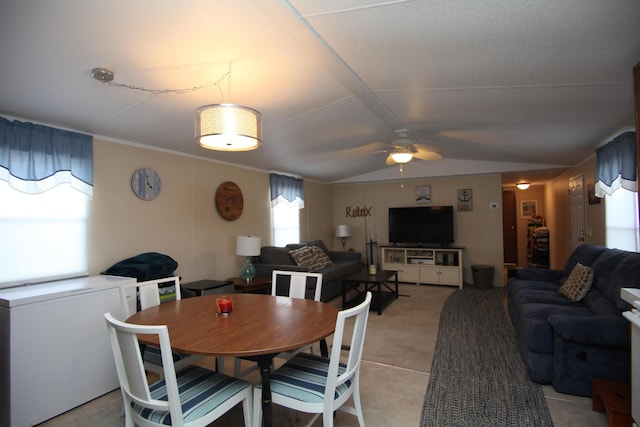 dining space with vaulted ceiling and ceiling fan