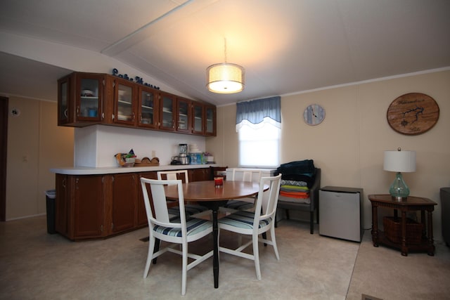 dining area with vaulted ceiling