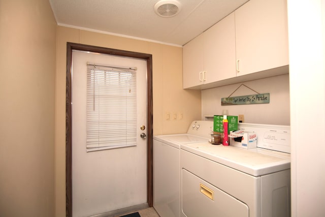 clothes washing area with visible vents, ornamental molding, independent washer and dryer, and cabinet space