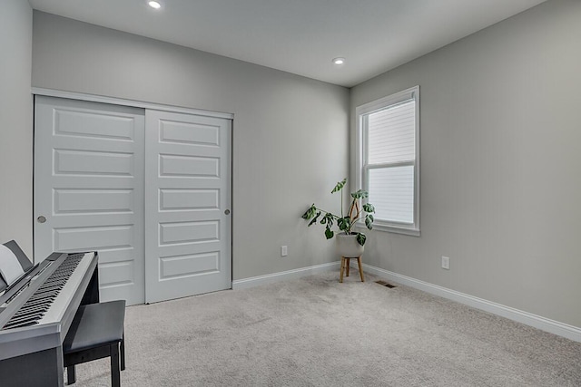 office space with light carpet, visible vents, baseboards, and recessed lighting