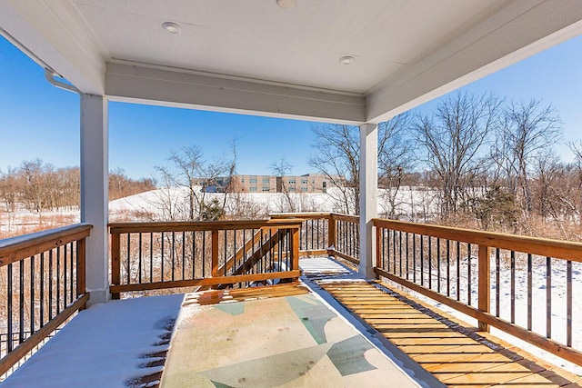 view of snow covered deck