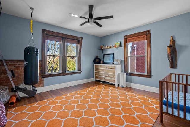 bedroom featuring wood-type flooring and ceiling fan