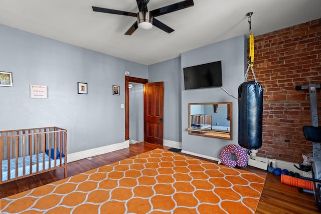 unfurnished bedroom with ceiling fan and dark hardwood / wood-style flooring