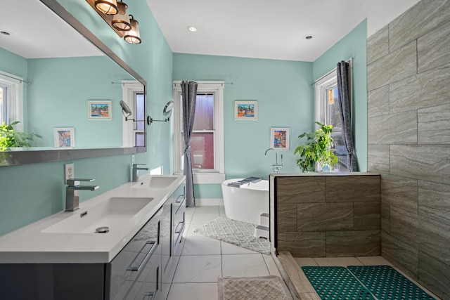 bathroom featuring vanity and a bathtub