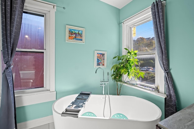 bathroom featuring a tub to relax in